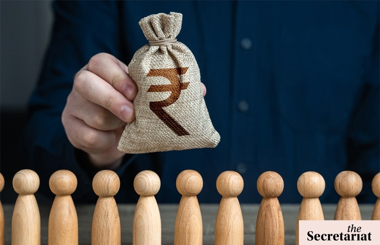 A bag with rupees on it presented in front of a panel of wooden people