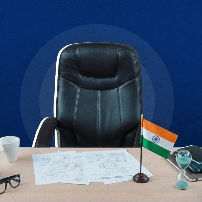 Empty government office desk with Indian flag symbolising new JS-level appointments